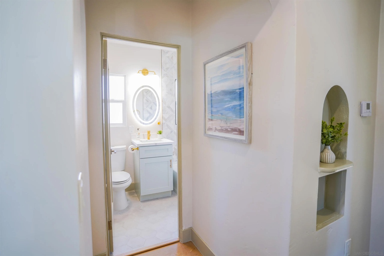 08 inside home inspection corridor craftsman for sale north park arched built in shelves hallway bathroom portia green realtor compass san diego