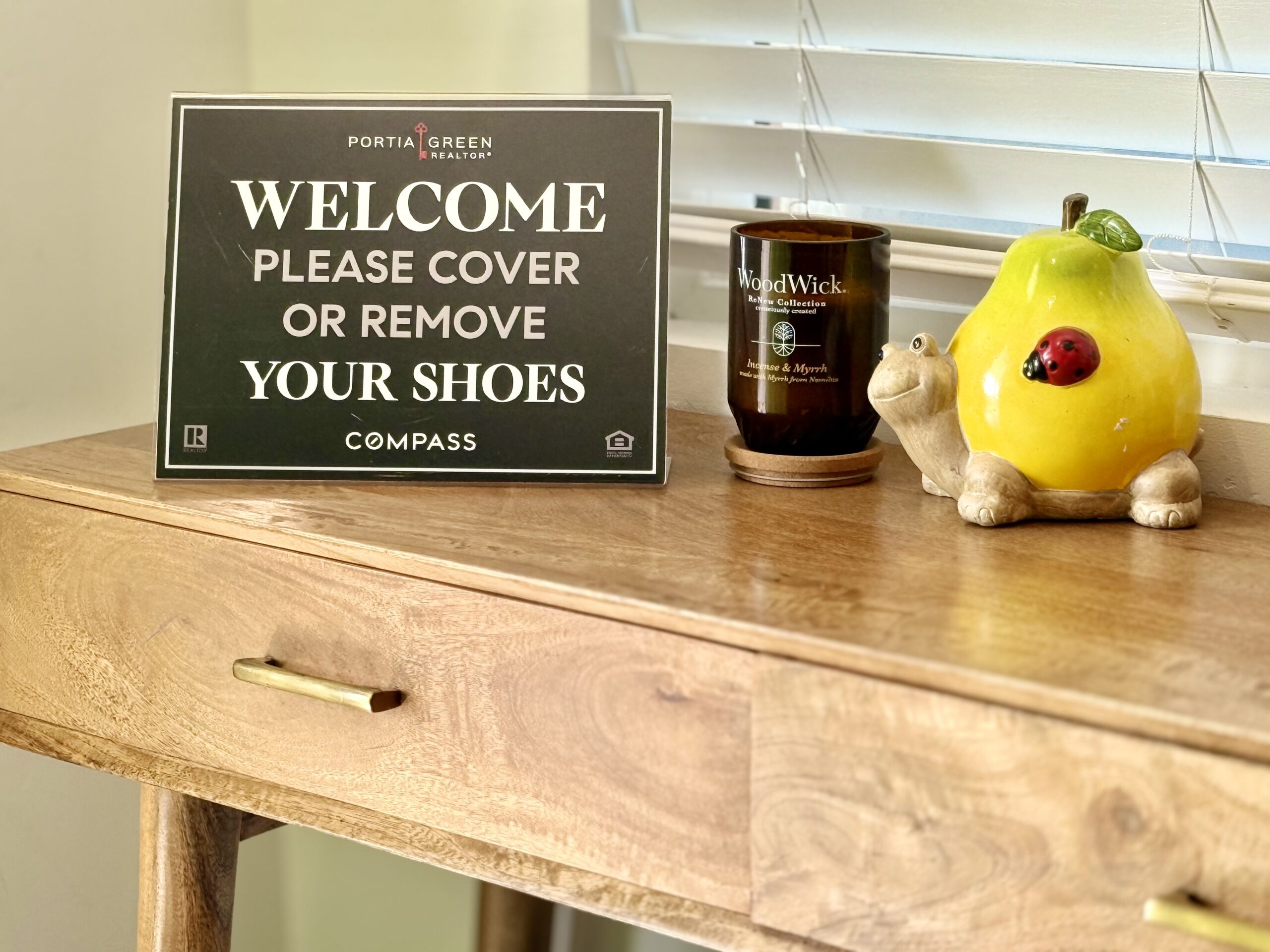 Entryway photo with welcome sign and staging décor at 2146 Franklin Avenue open house in Logan Heights listed by Portia Green, REALTOR® at Compass in San Diego.